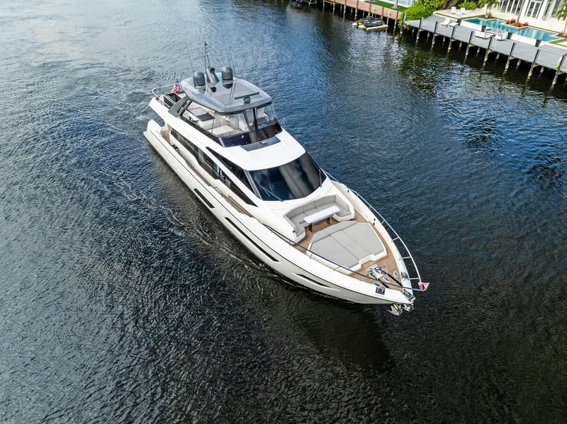 Slide: The Image of Luxurious 2019 Ferretti Yachts 780 cruising on a serene waterway. - 4
