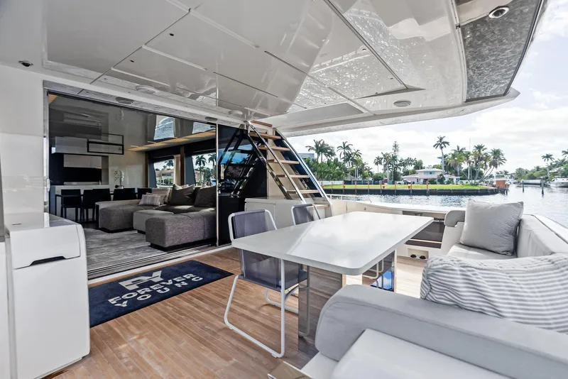 Slide: The Image of Luxurious 2019 Ferretti Yachts 780 interior with modern seating and waterfront view. - 40