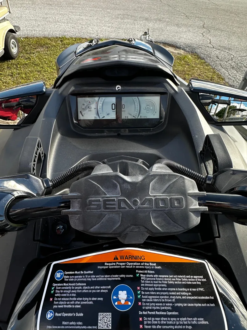 Slide: The Image of 2023 Sea-Doo RXP-X 300 dashboard view with control panel and warning label. - 8