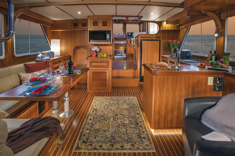 Slide: The Image of Luxurious interior of 2026 Helmsman Trawlers 38E Pilothouse with elegant wood finish and ocean view. - 18
