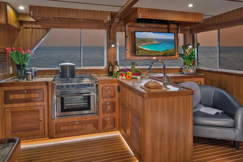 Slide: The Image of Luxurious 2026 Helmsman Trawlers 38E Pilothouse kitchen with ocean view and modern amenities. - 19