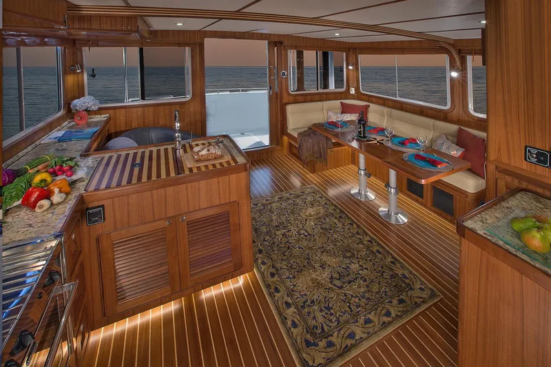 Slide: The Image of Luxurious interior of 2026 Helmsman Trawlers 38E Pilothouse with elegant wood finish and ocean view. - 21