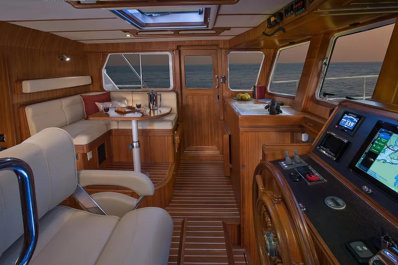 Slide: The Image of Luxurious 2026 Helmsman Trawlers 38E Pilothouse interior with elegant wood finish and modern navigation. - 23