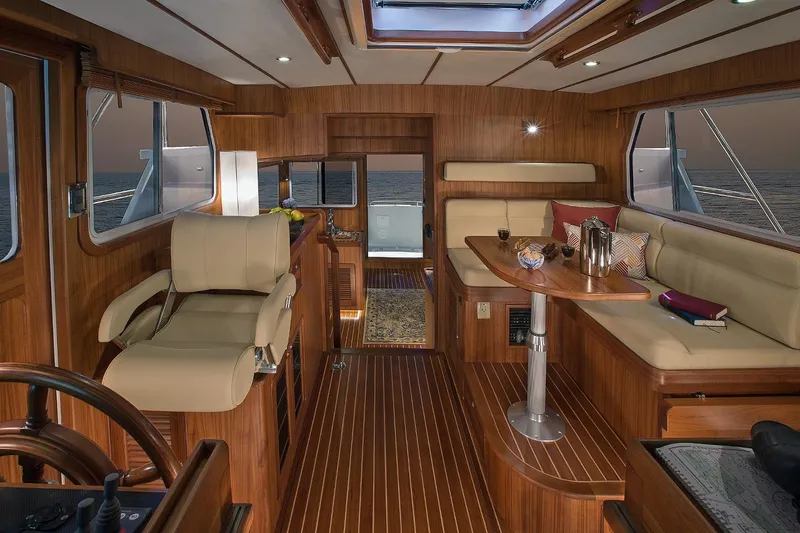 Slide: The Image of Luxurious interior of 2026 Helmsman Trawlers 38E Pilothouse with elegant wood finish. - 24