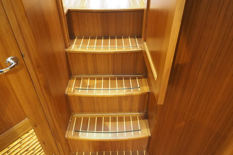 Slide: The Image of Wooden interior stairs of 2026 Helmsman Trawlers 38E Pilothouse yacht. - 29