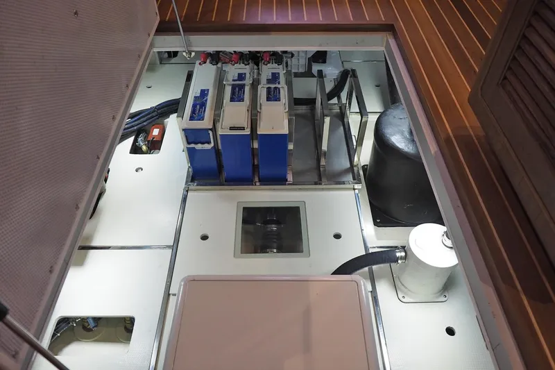 Slide: The Image of Engine room of 2026 Helmsman Trawlers 38E Pilothouse with batteries and equipment. - 38