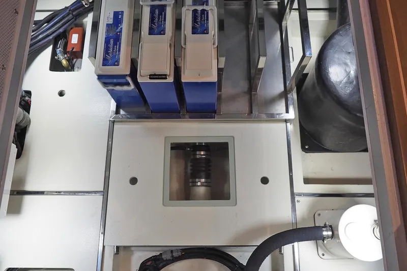 Slide: The Image of Engine room of 2026 Helmsman Trawlers 38E Pilothouse with batteries and equipment. - 39