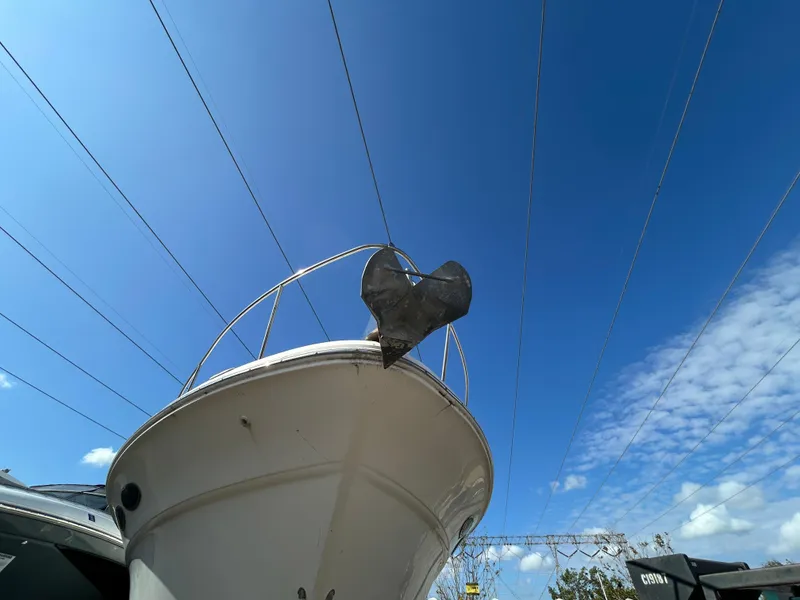 Slide: The Image of 2002 Sea Ray 340 Sundancer boat under clear blue sky, viewed from below. - 10