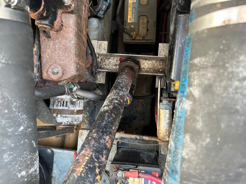 Slide: The Image of Engine compartment of a 2002 Sea Ray 340 Sundancer boat, showing mechanical components. - 15