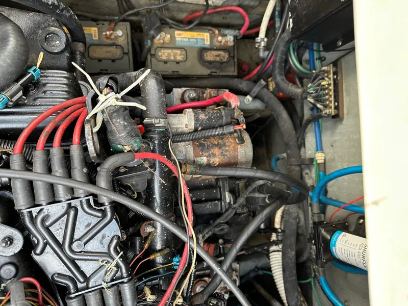 Slide: The Image of Engine compartment of a 2002 Sea Ray 340 Sundancer with visible wiring and components. - 16