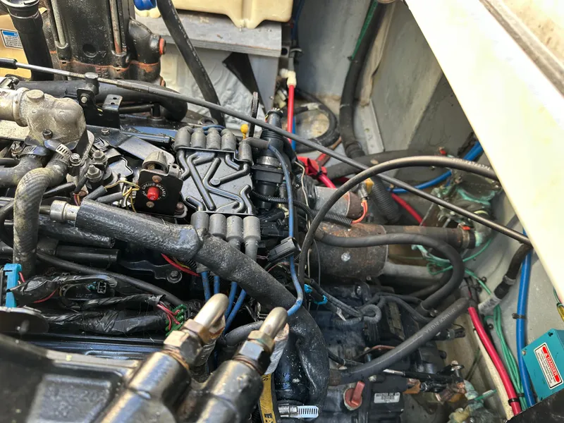Slide: The Image of Engine compartment of a 2002 Sea Ray 340 Sundancer boat, showing various mechanical components. - 17