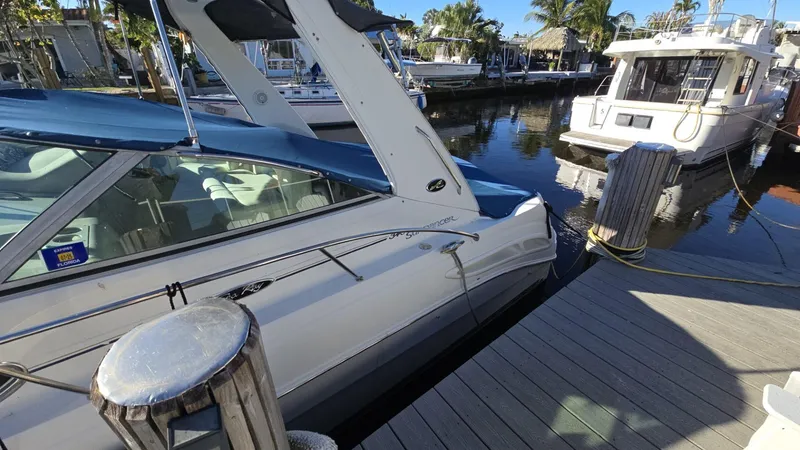 Slide: The Image of 2002 Sea Ray 340 Sundancer docked at marina, sunny day, calm waters. - 30