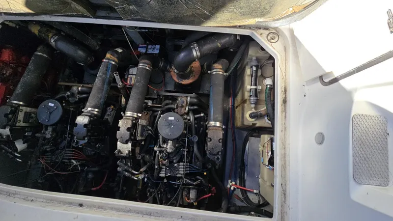 Slide: The Image of Engine compartment of 2002 Sea Ray 340 Sundancer boat, showing detailed mechanical components. - 8