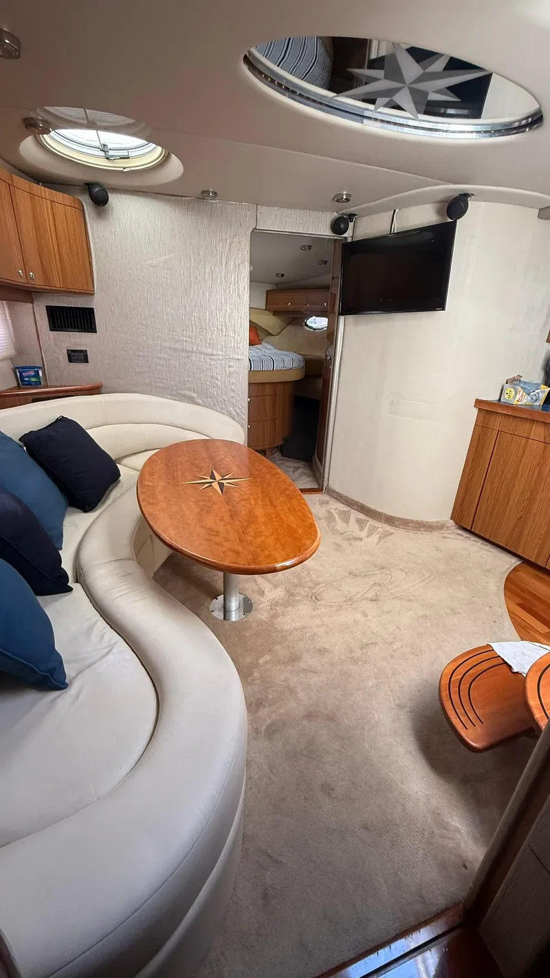 Slide: The Image of Interior of 2003 Regal Commodore 4260 yacht with plush seating and modern amenities. - 15