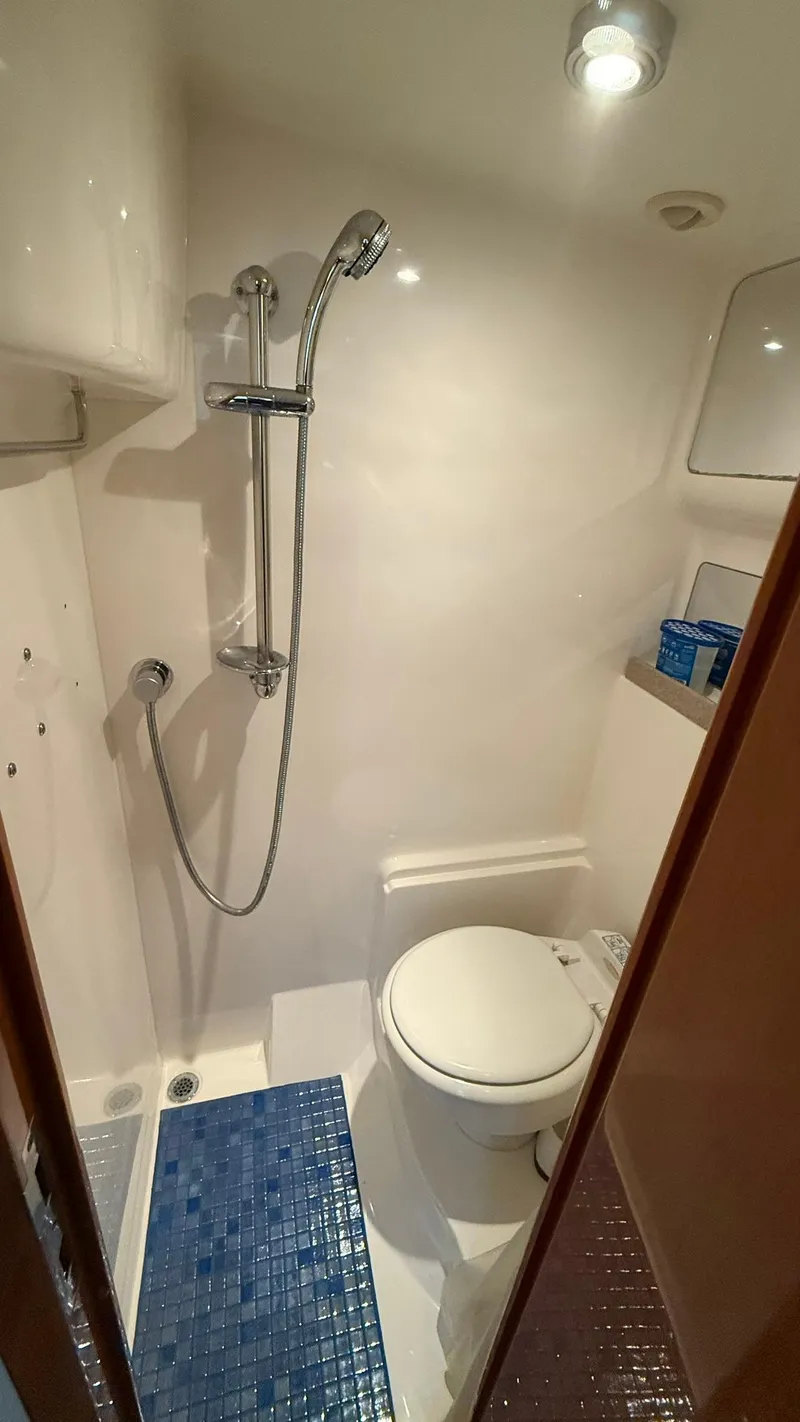 Slide: The Image of Compact bathroom in 2003 Regal Commodore 4260 yacht with shower and toilet. - 19