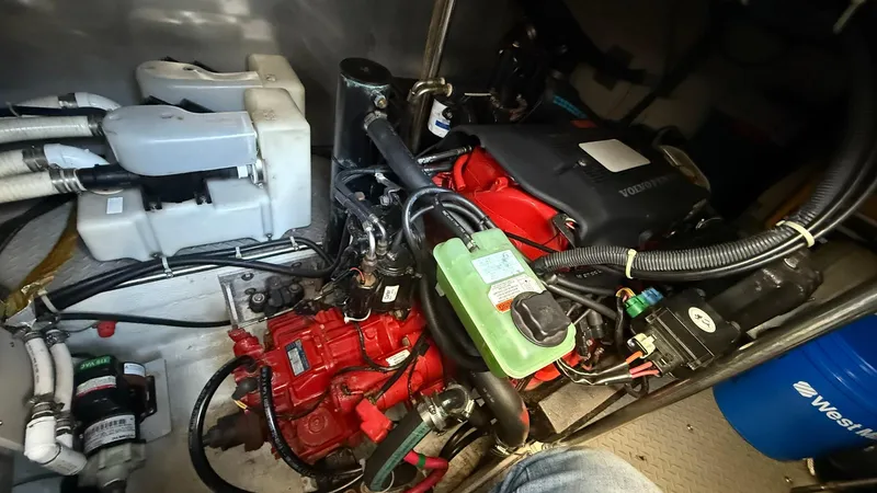 Slide: The Image of Engine compartment of a 2003 Regal Commodore 4260 boat, showcasing mechanical components. - 24