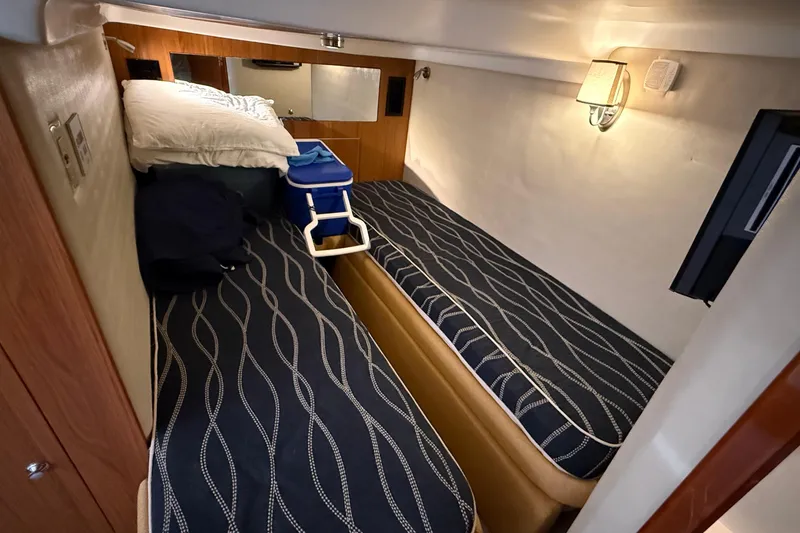 Slide: The Image of 2003 Regal Commodore 4260 cabin with twin beds and modern decor. - 37