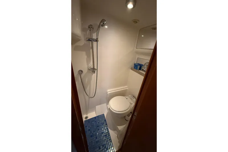 Slide: The Image of Compact bathroom in 2003 Regal Commodore 4260 yacht with shower and toilet. - 38
