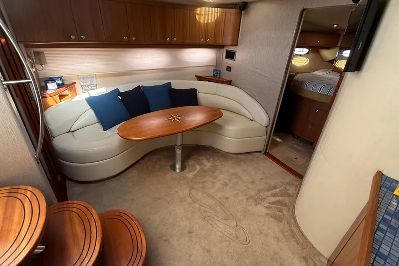 Slide: The Image of Luxurious interior of 2003 Regal Commodore 4260 yacht with plush seating and elegant wood finishes. - 40