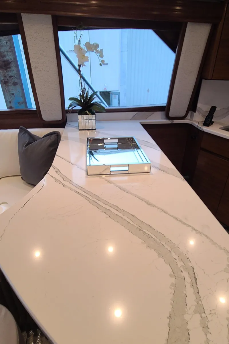 Slide: The Image of Luxurious interior of 2024 Viking 54 Convertible yacht with elegant countertop and decor. - 6