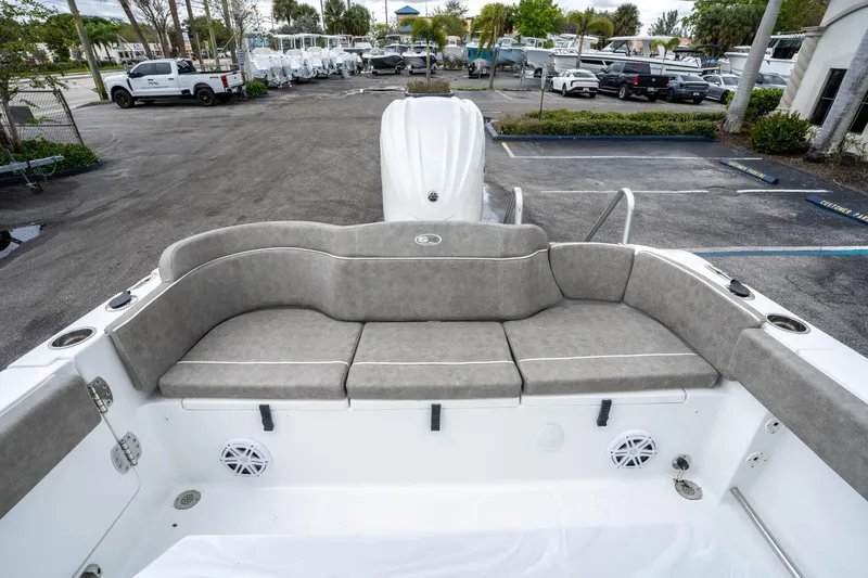 Slide: The Image of 2025 Sea Hunt Ultra 245 SE boat with spacious seating and modern design. - 10