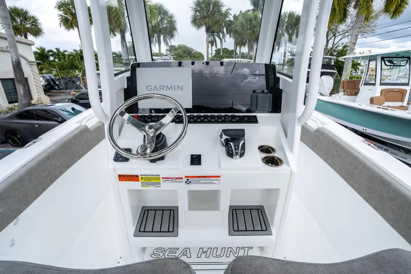 Slide: The Image of 2025 Sea Hunt Ultra 245 SE boat dashboard with Garmin navigation system. - 22