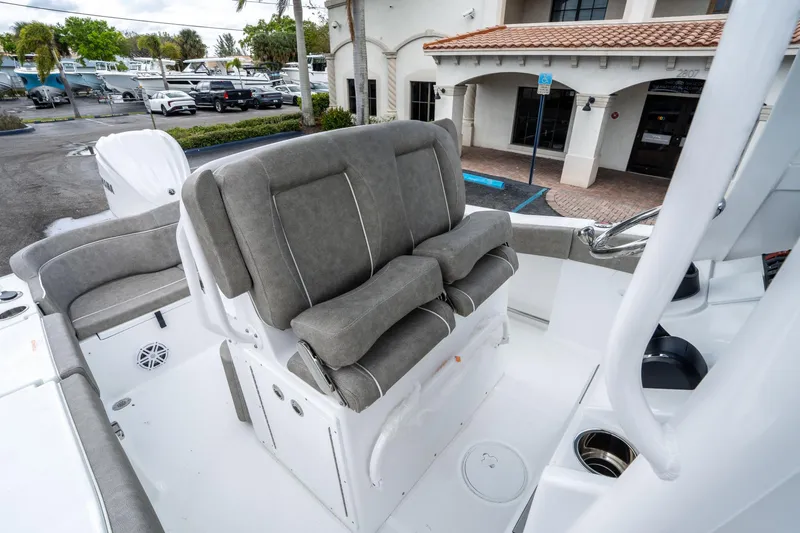 Slide: The Image of 2025 Sea Hunt Ultra 245 SE boat interior with cushioned seating and modern design. - 26