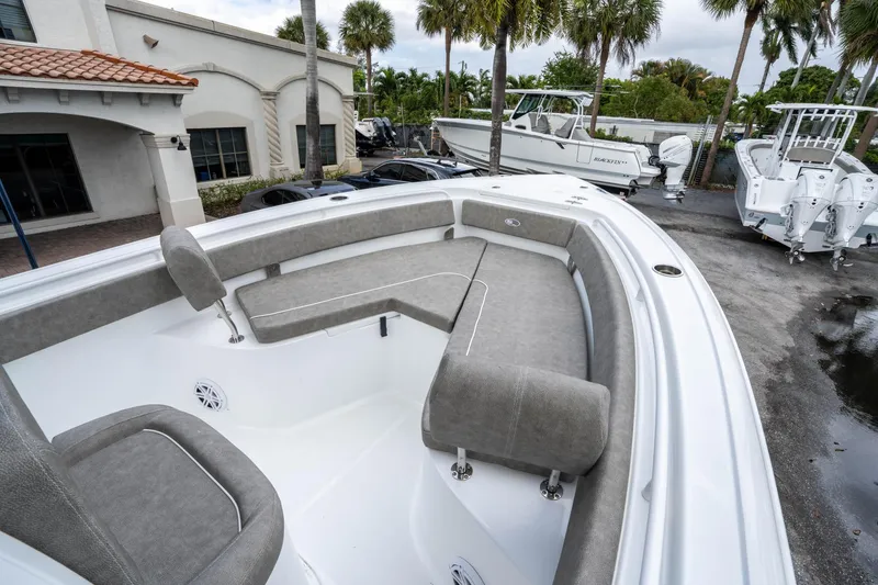 Slide: The Image of 2025 Sea Hunt Ultra 245 SE boat with spacious seating and modern design. - 31