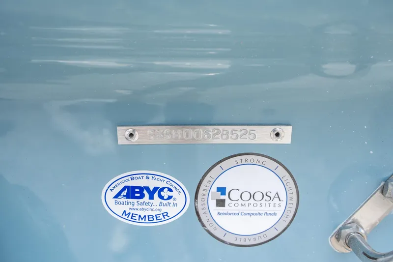 Slide: The Image of 2025 Sea Hunt Ultra 245 SE boat with ABYC and Coosa Composites certification labels. - 39