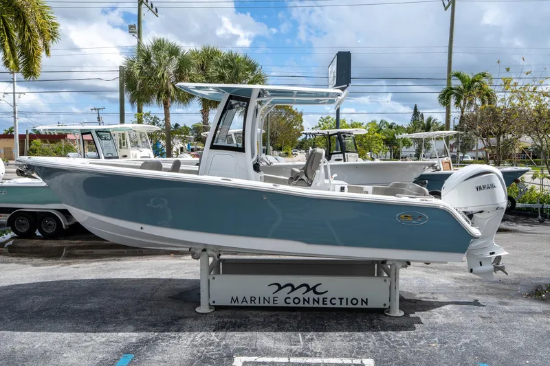 Slide: The Image of 2025 Sea Hunt Ultra 245 SE boat displayed at Marine Connection dealership. - 5