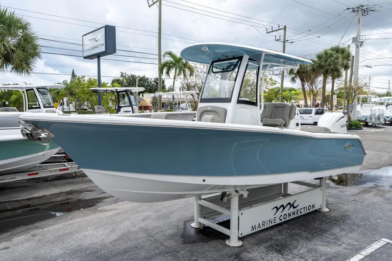 Slide: The Image of 2025 Sea Hunt Ultra 245 SE boat displayed at Marine Connection dealership. - 6