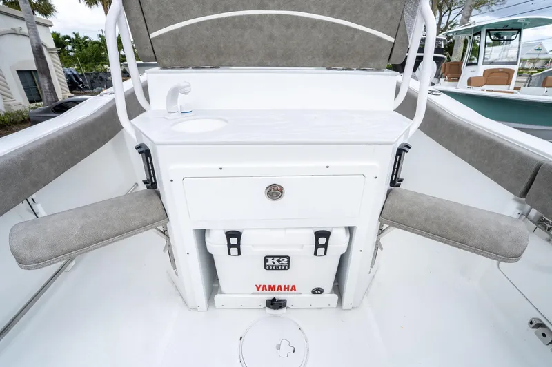 Slide: The Image of 2025 Sea Hunt Ultra 245 SE boat interior with seating and storage. - 16