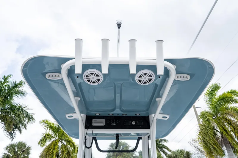 Slide: The Image of T-top of 2025 Sea Hunt Ultra 245 SE boat with rod holders and speakers. - 19