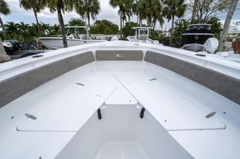 Slide: The Image of 2025 Sea Hunt Ultra 245 SE boat interior with seating and storage compartments. - 34