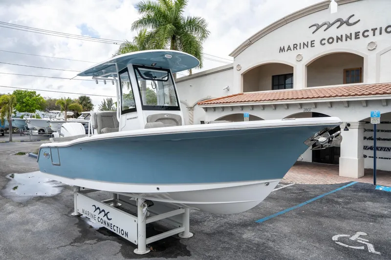 Slide: The Image of 2025 Sea Hunt Ultra 245 SE boat displayed at Marine Connection dealership. - 8