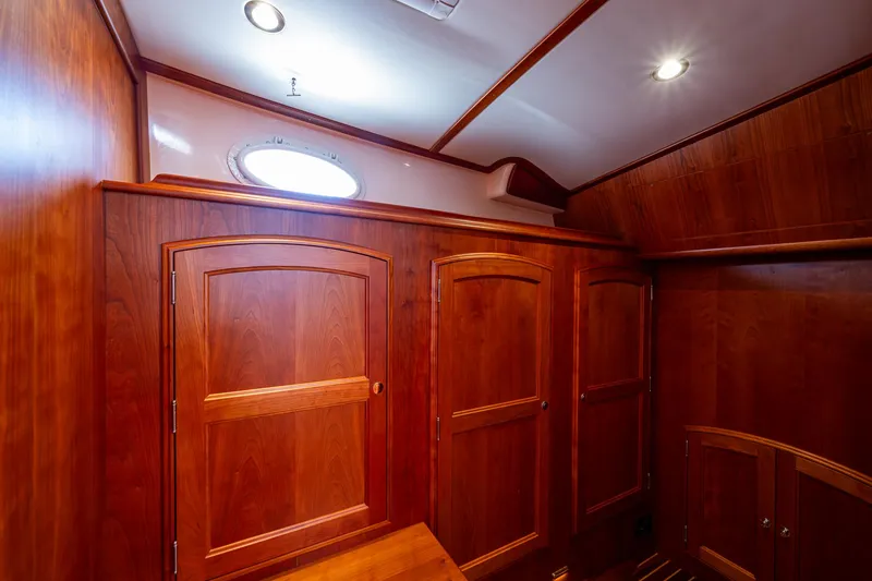 Slide: The Image of Interior of 2021 Hinckley Talaria 43 Motoryacht with elegant wooden cabinetry. - 24