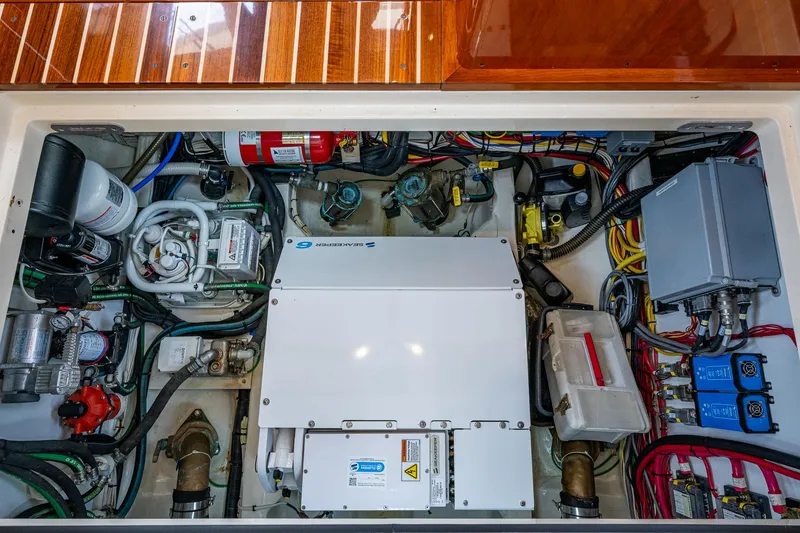 Slide: The Image of Engine room of 2021 Hinckley Talaria 43 Motoryacht, showcasing mechanical and electrical systems. - 36