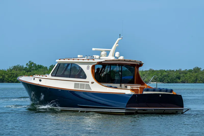 Slide: The Image of 2021 Hinckley Talaria 43 Motoryacht cruising on calm waters. - 40