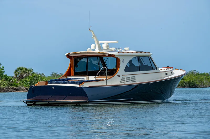 Slide: The Image of 2021 Hinckley Talaria 43 Motoryacht cruising on calm waters, showcasing elegant design. - 41