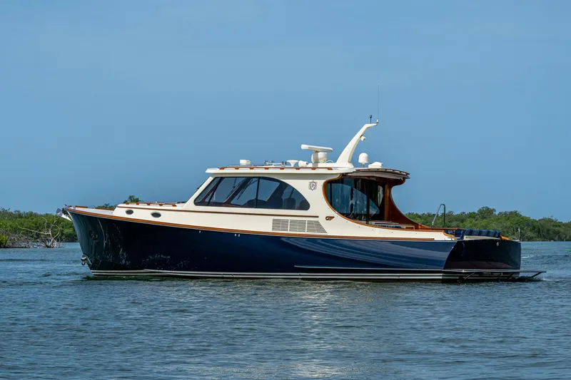 The Image of 2021 Hinckley Talaria 43 Motoryacht cruising on calm waters. - 0