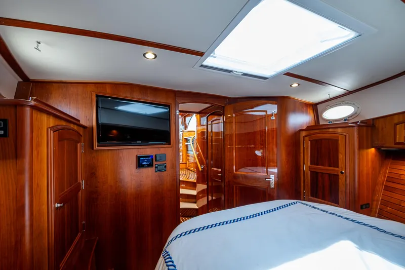 Slide: The Image of Luxurious interior of 2021 Hinckley Talaria 43 Motoryacht with wood finish and modern amenities. - 18