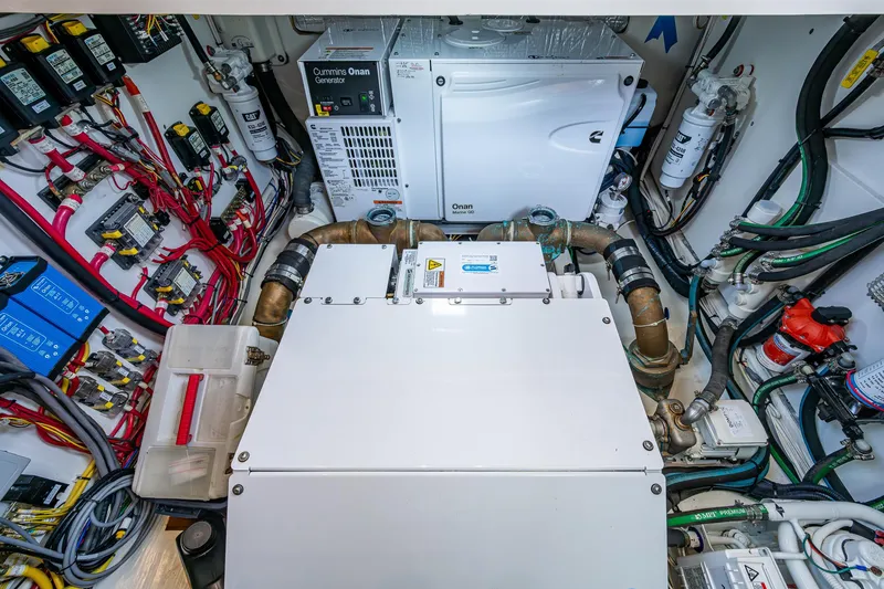 Slide: The Image of Engine room of 2021 Hinckley Talaria 43 Motoryacht with Cummins Onan generator and wiring. - 39