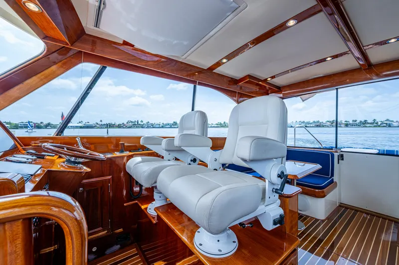 Slide: The Image of Luxurious interior of 2021 Hinckley Talaria 43 Motoryacht with plush seating and wooden accents. - 6