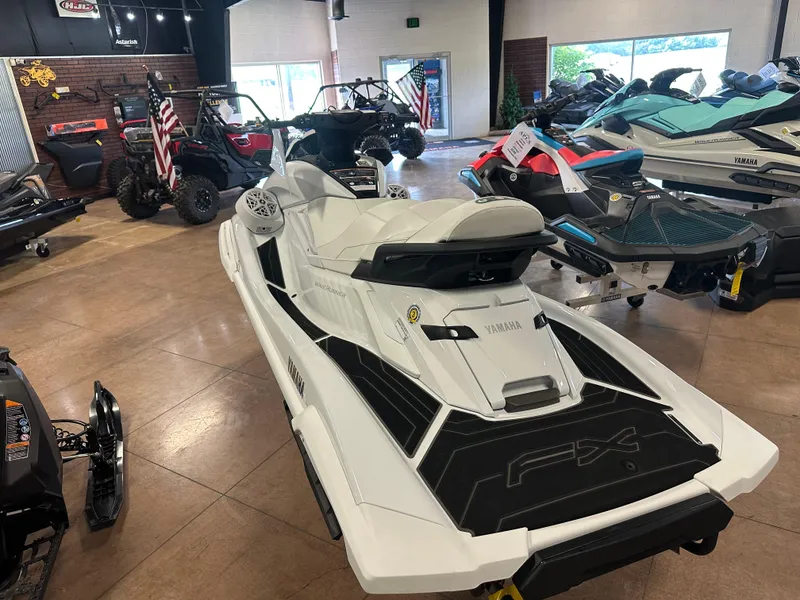 Slide: The Image of 2025 Yamaha WaveRunner FX Cruiser SVHO displayed in a showroom with other vehicles. - 3