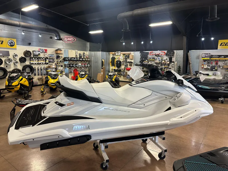 Slide: The Image of 2025 Yamaha WaveRunner FX Cruiser SVHO in showroom, surrounded by various vehicle accessories. - 4