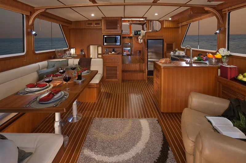 Slide: The Image of Luxurious interior of 2026 Helmsman Trawlers 43E PILOTHOUSE with elegant dining and kitchen area. - 20