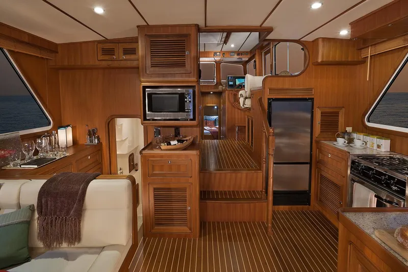 Slide: The Image of Luxurious interior of 2026 Helmsman Trawlers 43E Pilothouse with wood finish and modern amenities. - 21