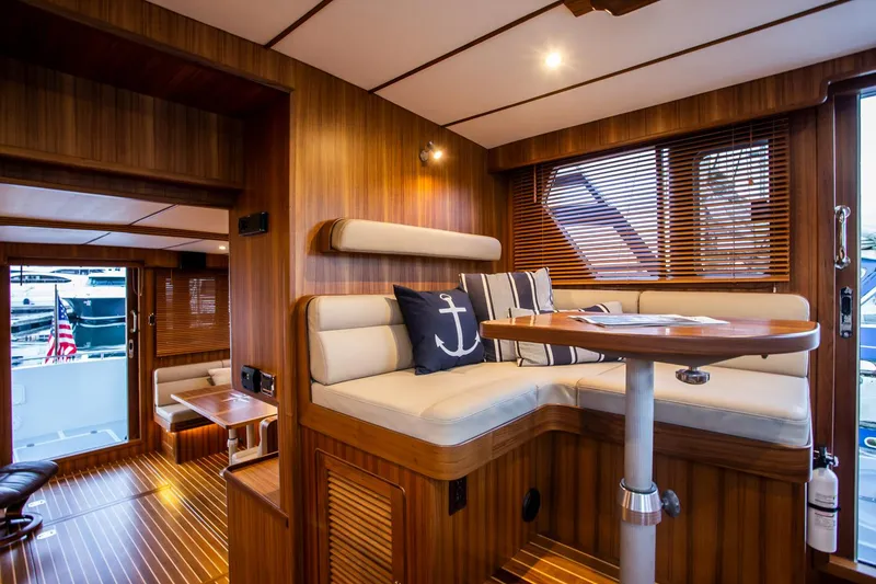Slide: The Image of Luxurious interior of 2026 Helmsman Trawlers 43E Pilothouse with wood finish and nautical decor. - 30