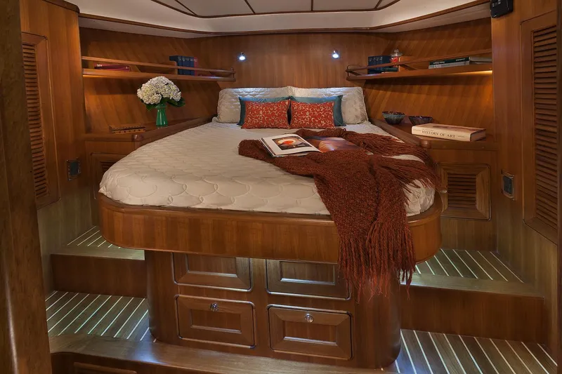 Slide: The Image of Luxurious cabin interior of 2026 Helmsman Trawlers 43E PILOTHOUSE with cozy bed and wooden finish. - 35