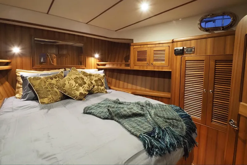 Slide: The Image of Luxurious cabin interior of 2026 Helmsman Trawlers 43E PILOTHOUSE with cozy bedding. - 36